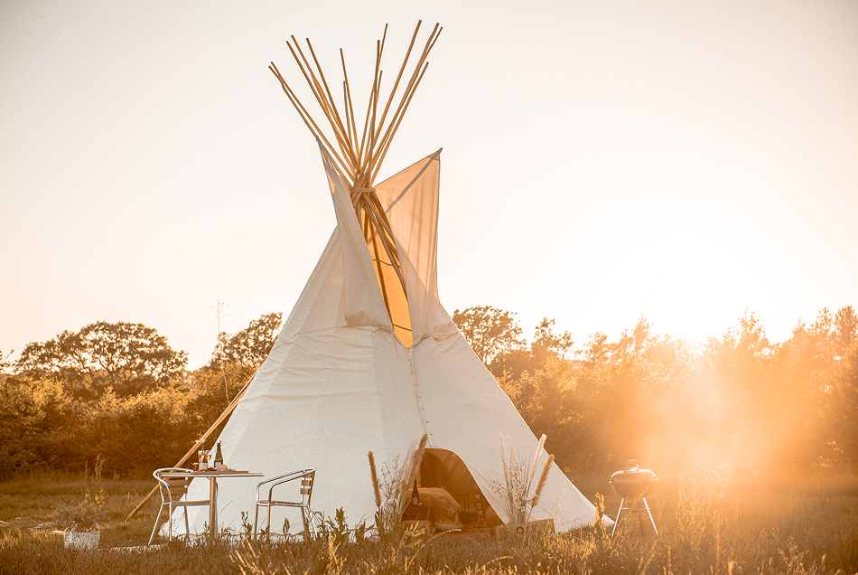 A luxury bell tent shown at sunset at Oastbrook Vineyard